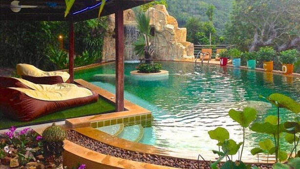 A pool area with a hot tub, a waterfall feature, and a view of a mountainous landscape. - Ever Dreamed of staying in a 2 Bedroom Castle SDV044C - By Samui Dream Villas (Koh Samui)