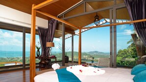 A bedroom with a large bed, a view of the ocean, and a wooden ceiling. - 2 Bedroom Sea View Villa Blue SDV080H-By Samui Dream Villas (Koh Samui)