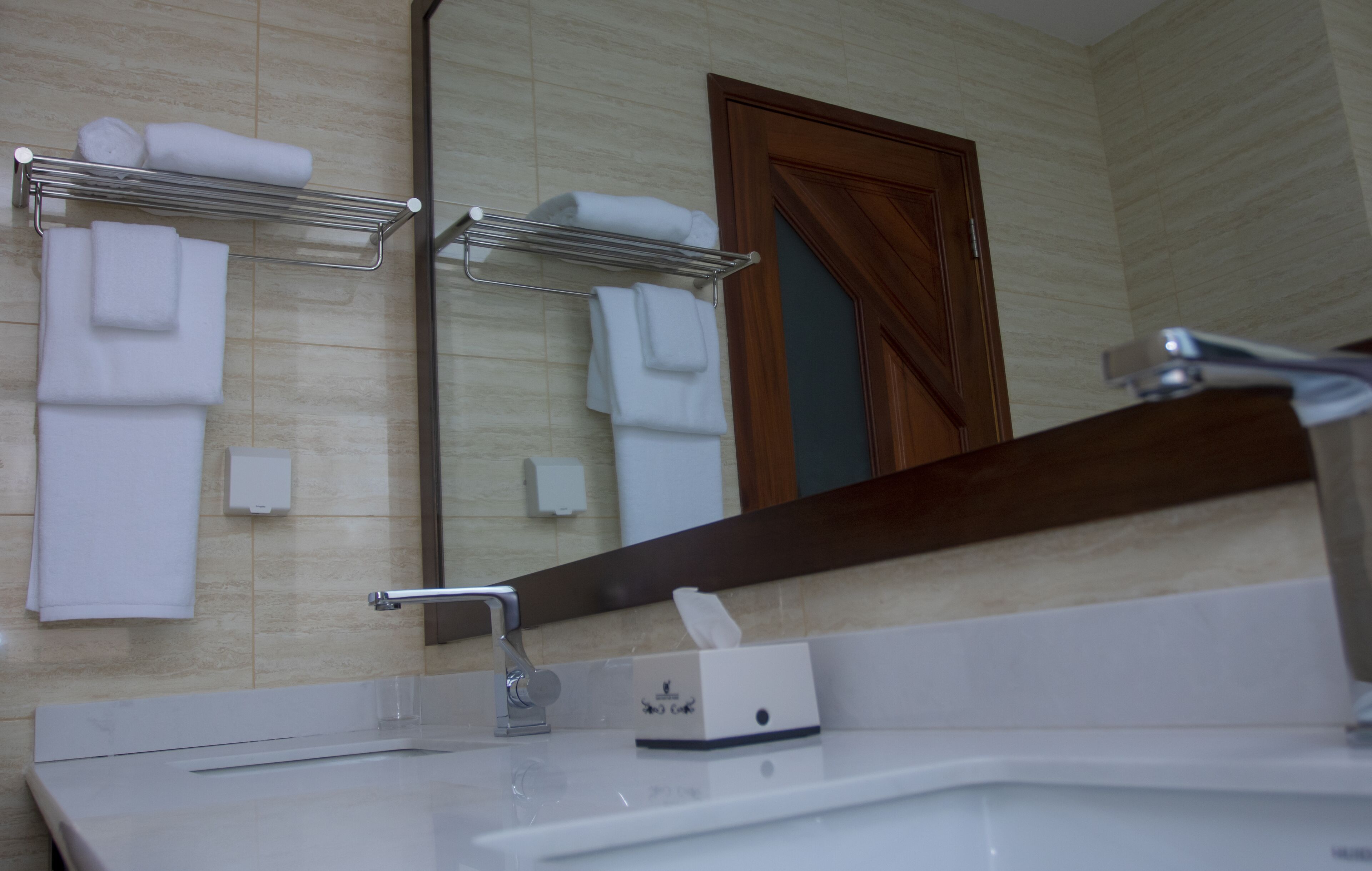 rainfall showerhead, hair dryer, slippers, towels