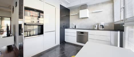 Apartment (23) | Private kitchen | Fridge, stovetop, electric kettle, cookware/dishes/utensils