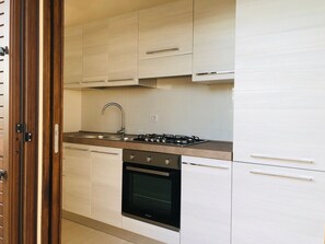 Apartment, 2 Bedrooms | Private kitchen | Full-size fridge, oven, stovetop, cookware/dishes/utensils