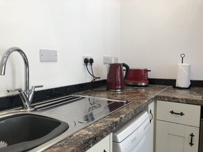 Fridge, microwave, oven, stovetop - Self Catering Studio Apartment (Bath)