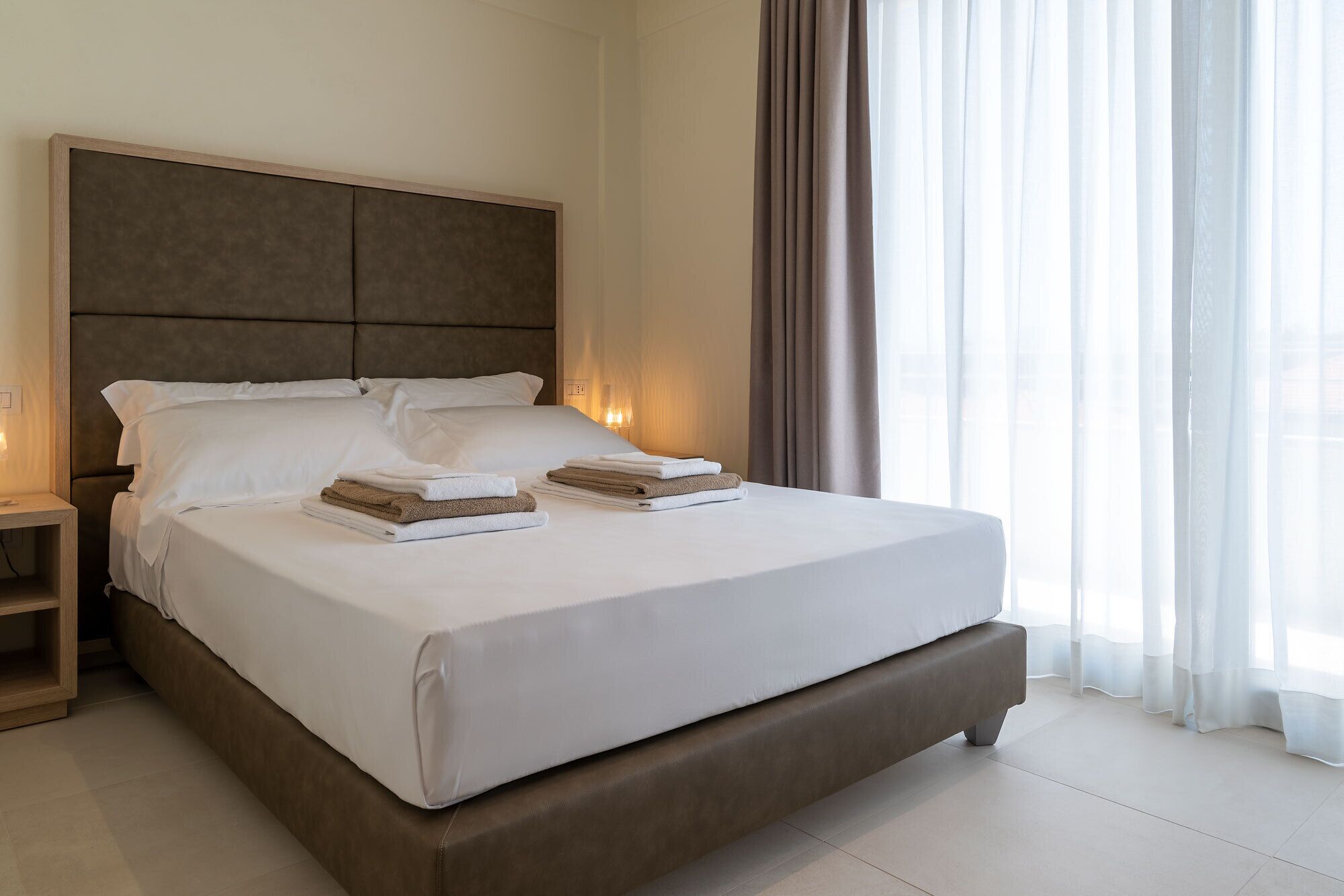 family room | premium bedding, down duvets, minibar, in-room safe