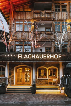 A two-story wooden building with a sign reading "FLACHAUERHOF". - Hotel Flachauerhof  (Flachau)