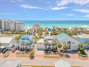A coastal hotel area with buildings and a beach view.