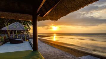 On the beach, black sand