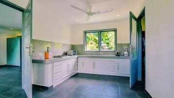 Fridge, microwave, stovetop, coffee/tea maker