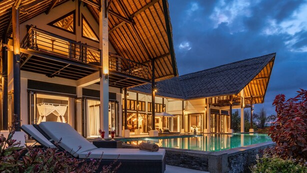 A luxurious villa with a swimming pool, outdoor seating, and a covered patio area. - Villa Bali Il Mare (Gerokgak)
