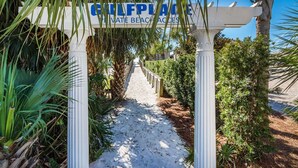 A pathway leading to a private beach area with a sign reading "GULFPLACE PRIVATE BEACH ACCESS". - ☀️Top Floor-Gulf Views-Pools-30A-Gulf Place Getaway (Santa Rosa Beach)
