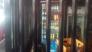 A vending machine area with a 'JINNE' sign, surrounded by metal bars. - Silk Guest House (Nairobi)