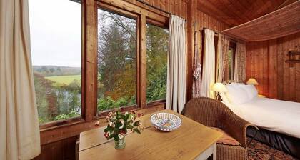 Unique Norwegian cabin perched above the River Findhorn with a stunning view