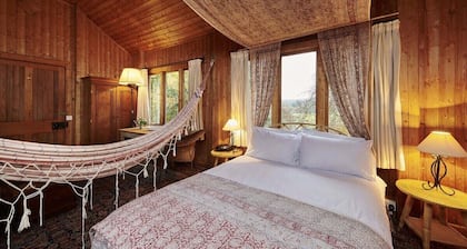 Unique Norwegian cabin perched above the River Findhorn with a stunning view