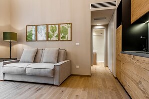 Apartamento estándar, 1 habitación | Sala de estar | Una Smart TV