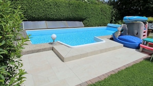 A swimming pool with a slide and a small inflatable pool. - Lovely Holiday Home near Wernberg (Wernberg)