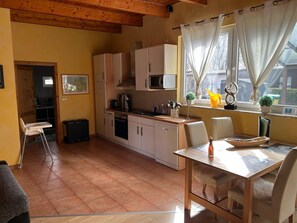 Bungalow | Cuisine privée | Chaise haute
