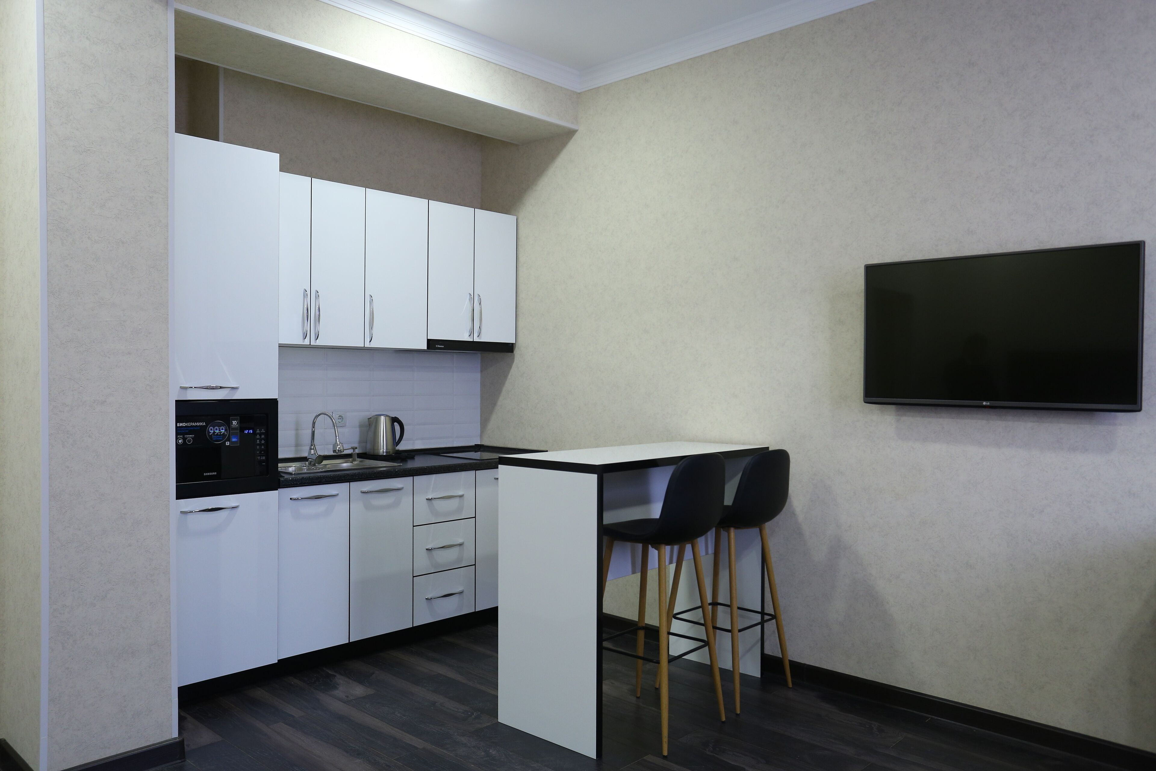 mini-fridge, electric kettle, paper towels