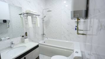 Deluxe Double or Twin Room, Balcony | Bathroom | Separate tub and shower, rainfall showerhead, free toiletries