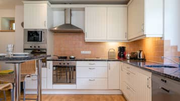Villa | Private kitchen | High chair, cookware/dishes/utensils