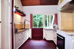 House | Private kitchen | Highchair - Cozy Holiday Home near Forest in Zuidwolde (Zuidwolde)