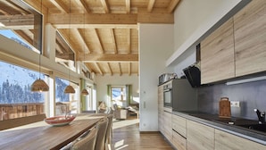 A modern kitchen with wooden cabinets and a large island.