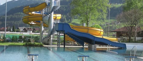 A water park with multiple slides and a pool area.