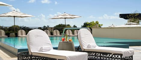 Outdoor pool, open 7:00 AM to 6:30 PM, pool umbrellas, pool loungers
