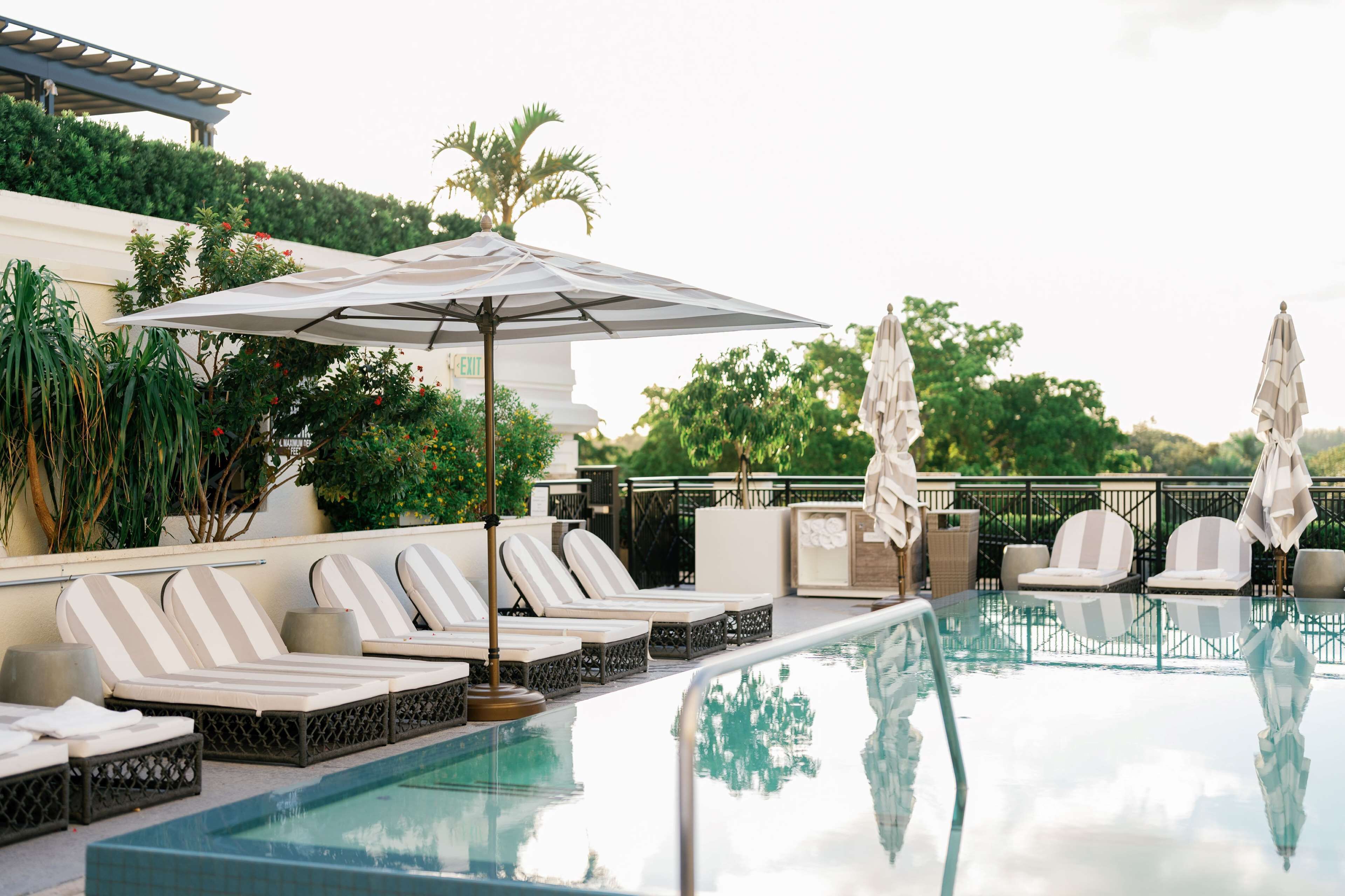 outdoor pool, open 7:00 am to 6:30 pm, pool umbrellas, pool loungers