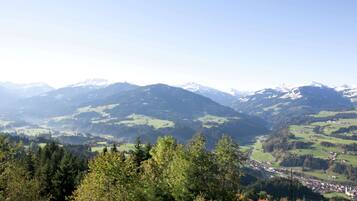 A mountainous landscape with a village nestled in the valley.