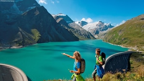 A mountainous landscape with a turquoise lake and a dam. - Beautiful Chalet in Zell Am See (Zell am See)