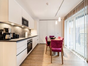 Appartement | Cuisine privée | Chaise haute