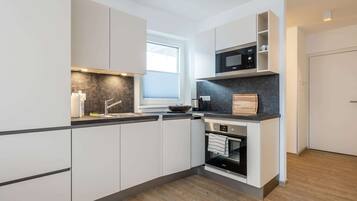 Apartment | Private kitchen | Microwave, stovetop, dishwasher, coffee/tea maker