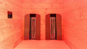 A wooden interior with two arched doorways and a control panel on the wall. - Elite Chalet near Ski Slopes in Westendorf (Westendorf)