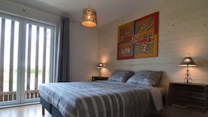 A bedroom with a large bed, two bedside lamps, a ceiling light, and a window with curtains. - Wonderful Country House With Huge Garden (Poperinge)