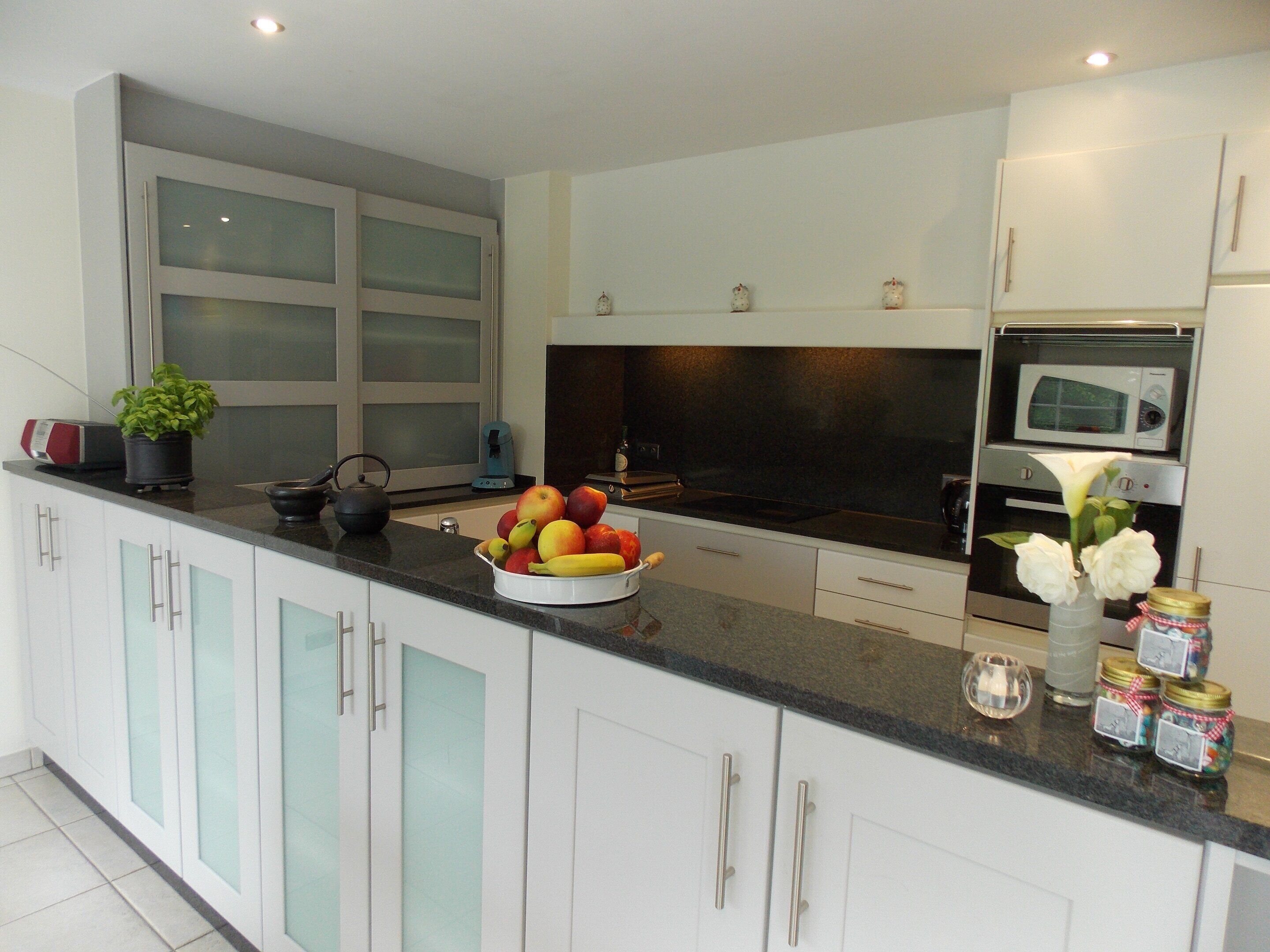 Villa | Private kitchen | Fridge, highchair