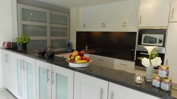 Villa | Private kitchen | Fridge, high chair