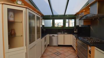 Villa | Private kitchen | Microwave, stovetop, dishwasher, high chair