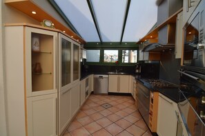 Villa | Private kitchen | Microwave, stovetop, dishwasher, highchair