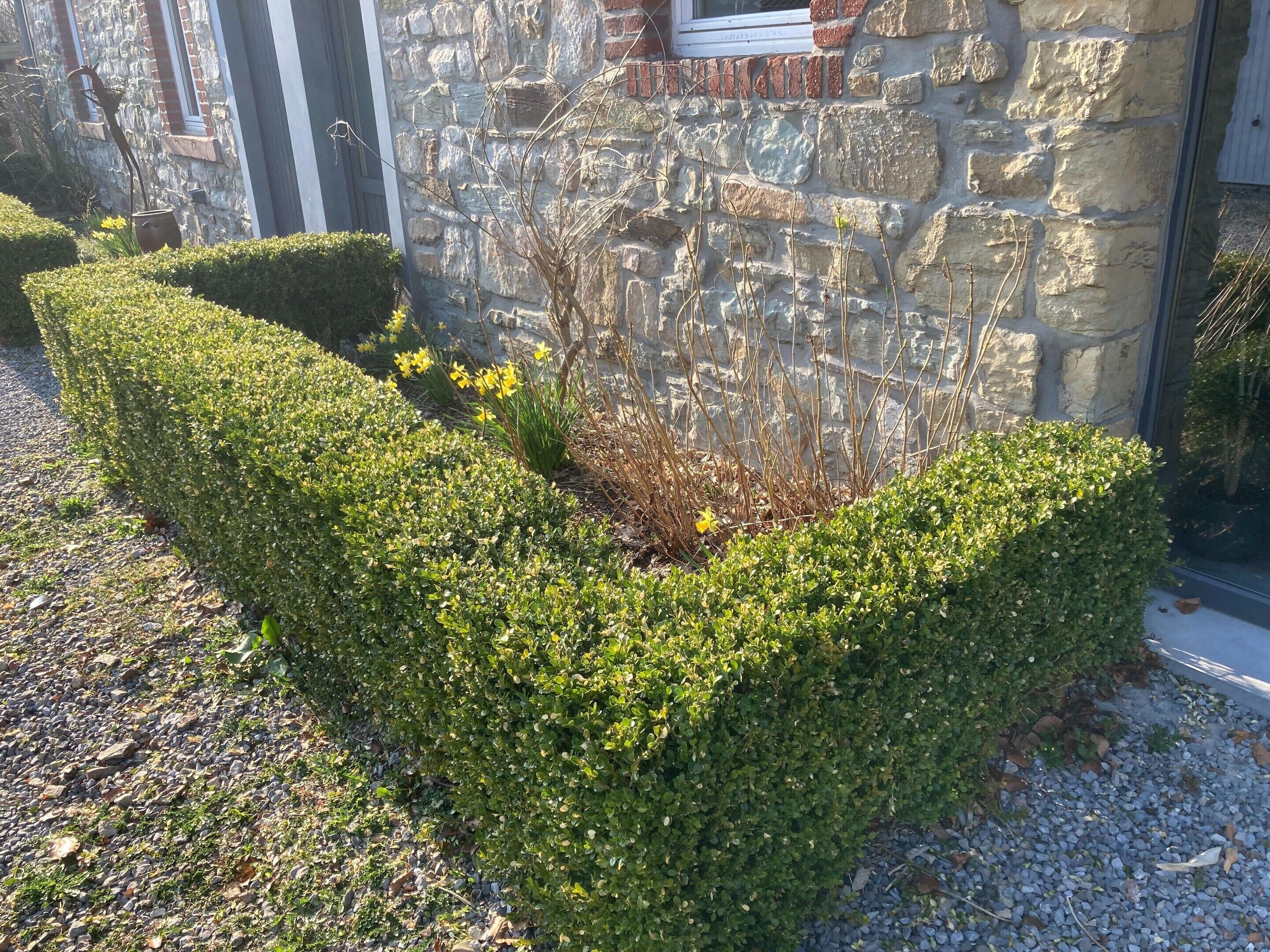 A stone building with a stone wall and a window.