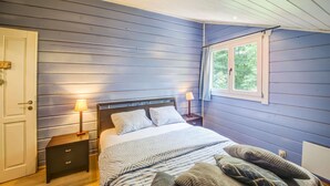 A bedroom with a bed, bedside tables, and a window. - Chalet With Sauna Near Durbuy (Durbuy)