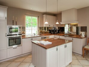 Villa | Private kitchen | Fridge, microwave, oven, highchair