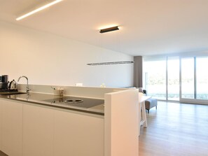Apartment | Private kitchen | Highchair - Bright Coastal Family Escape (De Panne)