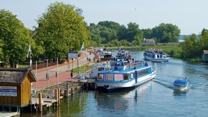 A river with boats docked at a pier. - Quaint Holiday Home near Forest in Stuer (Stuer)