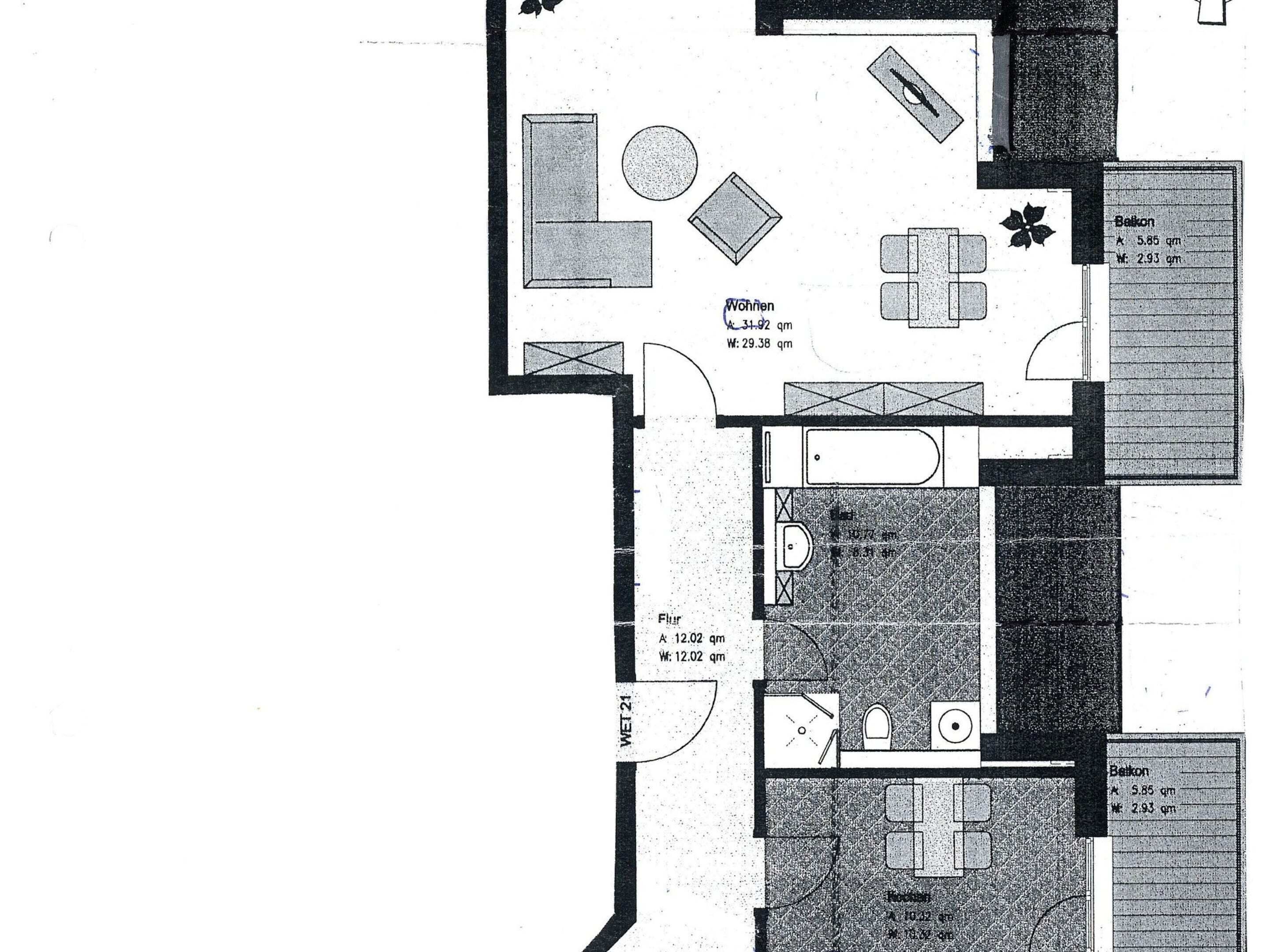 A floor plan of a hotel room with a living area, a bathroom, and a balcony.
