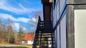 A wooden staircase leading to a building's entrance. - Chalet in Frankenau Nahe Skipisten & Edersee (Frankenau)