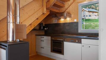Chalet | Private kitchen | Stovetop, electric kettle, cookware/dishes/utensils, dining table