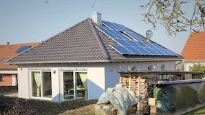 A house with a tiled roof, solar panels, and a satellite dish. - Garden Escape, Kleinwinklarn (Neunburg vorm Wald)