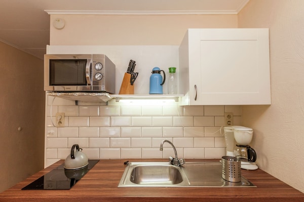 Apartment | Private kitchen | Stovetop, highchair