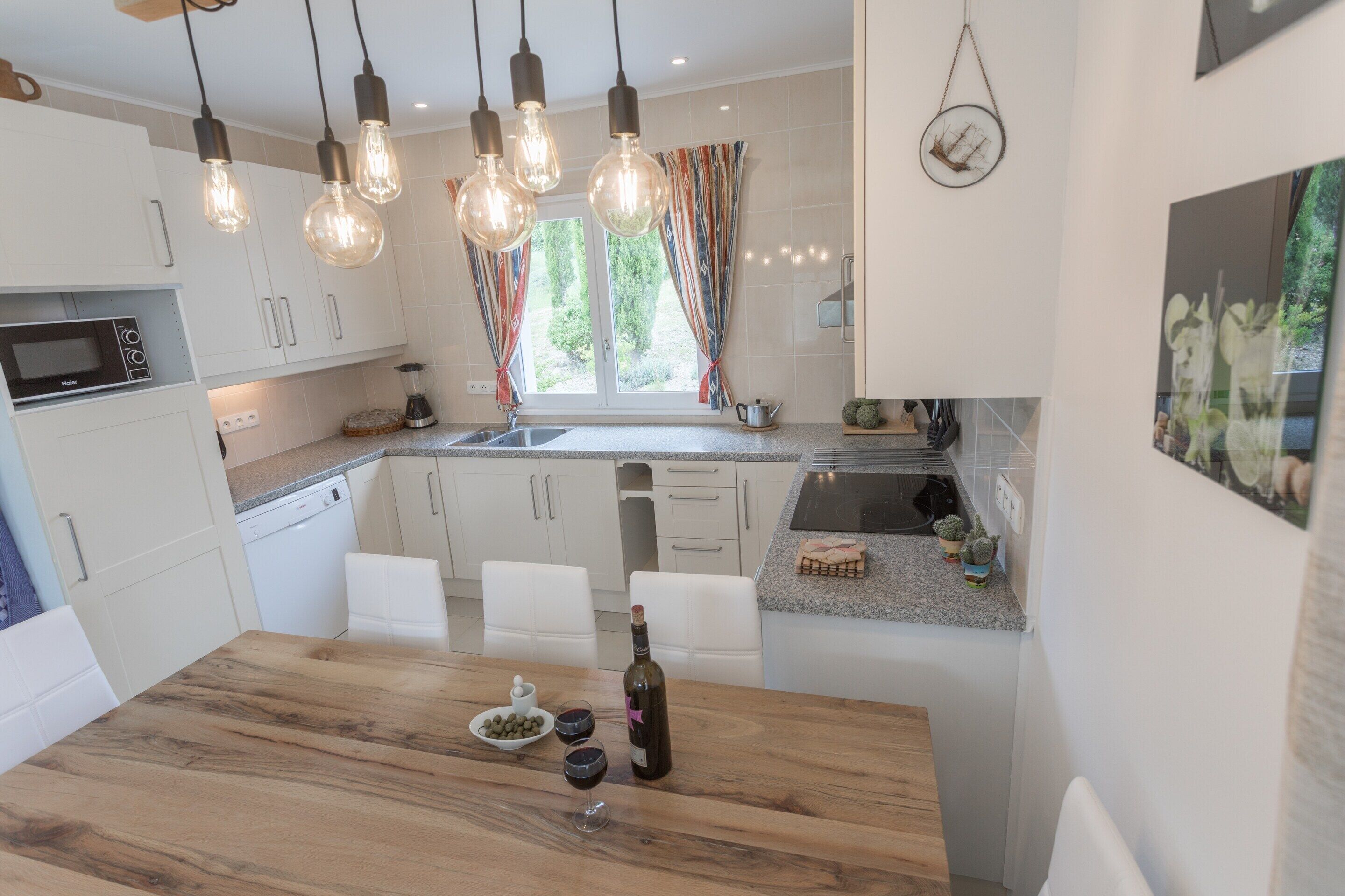 Villa | Private kitchen | Fridge, microwave, high chair