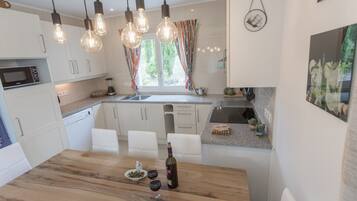 Villa | Private kitchen | Fridge, microwave, high chair