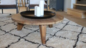 A round wooden table with a black tray and candles, set on a patterned rug in a room with a staircase and a blue cabinet. - Chalet in La Tzoumaz Near Ski Lift (Riddes)